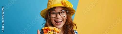 Latin girl holding pizza and pointing thumb up to the side smiling happy and opening mouth wearing sunglasses and summer hat