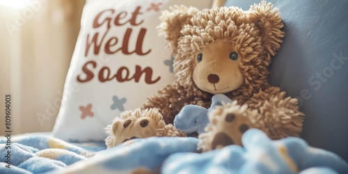 Plush teddy bear with a comforting Get Well Soon message on a pillow, evoking feelings of care, recovery, and comfort in soft lighting