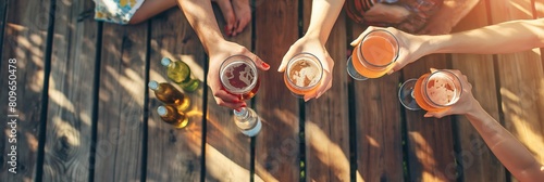 Group of friends clinking glasses in a sunset toast during a casual outdoor gathering, depicting camaraderie