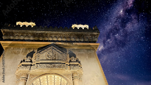 The iconic Patuxay Victory Monument in Vientiane, Laos, dramatically lit against a vivid starry night sky