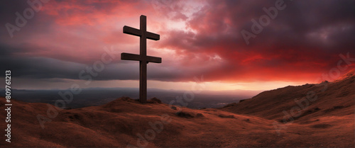 Golgotha hill landscape with dramatic and majestic red sky and clouds, cross silhouette symbolizing Jesus Christ's passion 