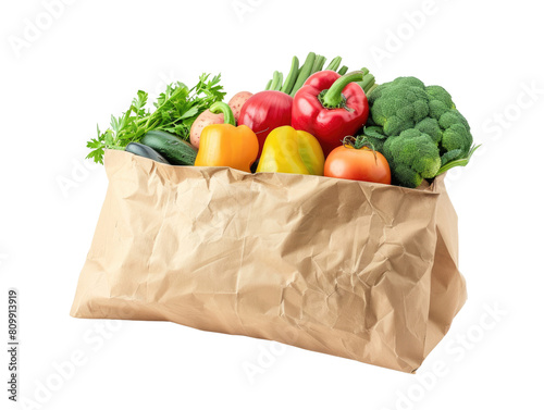 Overhead view of a brown paper bag filled with colorful mixed vegetables in isolated on transparent background