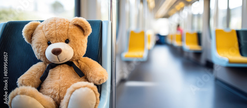 Teddy Bear Sitting Alone on a Train Seat
