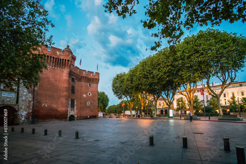 Fortress Porte Notre-Dame in Perpignan. Twilights in summertime. Gorgeous large trees (plane trees) along river Bassa!