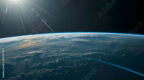 A panoramic view of the Earth's curve with a thin blue line of the ionosphere glowing at the edge, as seen from space