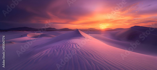 A vibrant sunset over coastal sand dunes, with the sky painted in hues of orange and purple, reflecting lightly on the undulating sand patterns
