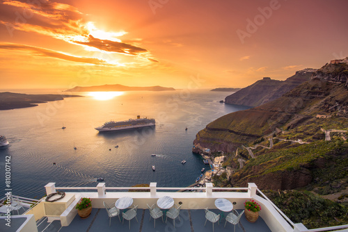 Sunset view over santorini caldera with cruise ship
