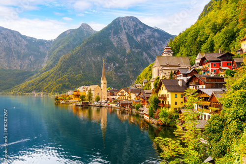 The picturesque lakefront townscape with homes and towers above the Tyrolian village of Hallstatt, Austria, a village on Lake Hallstatt's western shore in Austria's mountainous Salzkammergut region.