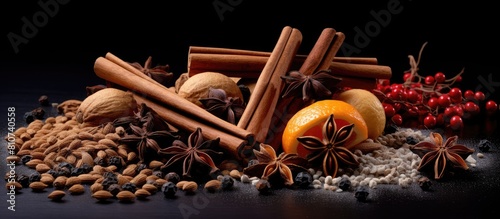 A collection of spice ingredients including cinnamon sticks anise stars nutmeg and brown sugar specifically designed for making mulled wine Ample copy space for additional elements