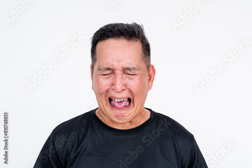 Middle aged Asian man with a disgusted expression, isolated on white