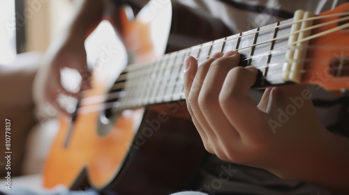 Close-up of a musician's hands skillfully playing an acoustic guitar.
