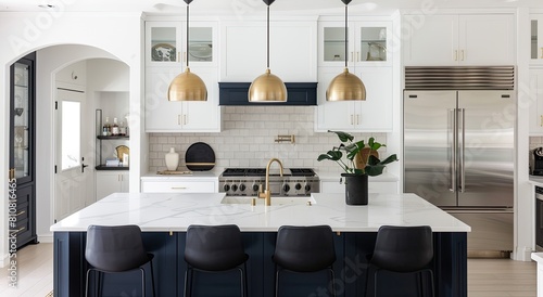 Kitchen with white cabinetry, stainless steel appliances, blue island