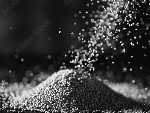 A pile of white grains is being poured out of a container. The grains are scattered all over the ground, creating a sense of chaos and disorder. The image evokes a feeling of emptiness
