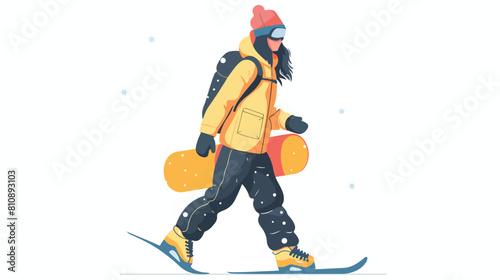 Female snowboarder walking with snowboard in hand. 