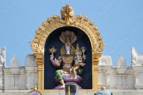 Avatar Vishnu Hayagriva with Lakshmi on the roof of a Hindu temple in India.