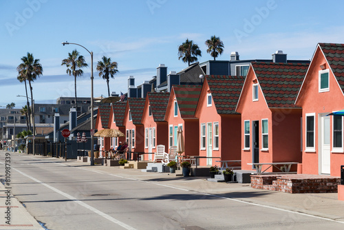 cute tiny symmetrical holiday home buildings at the beach of oceanside, california