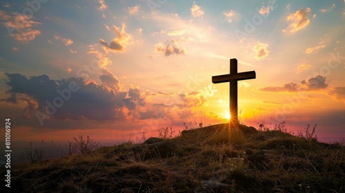 The powerful silhouette of a cross at sunset, standing atop a hill as a beacon of hope and a symbol of sacrifice and redemption in Christian faith
