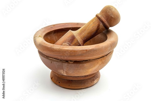 A mortar and pestle in a wooden bowl. Suitable for kitchen or cooking themes