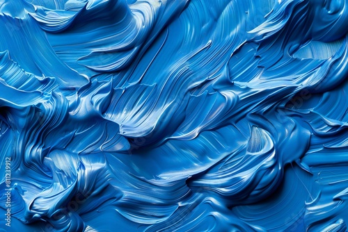Abstract background of blue acrylic paint on a white background close up