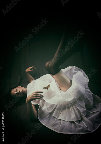 dancer lying on the floor with her legs up in a desolate attitude IV