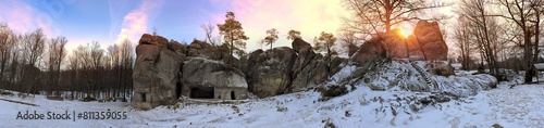 Dovbush rocks in winter in Bubnyshche, Carpathians, Ukraine, Europe. Huge stone giants rise in the snowy transparent beech forest, all-round panoramic views are unique without leaves