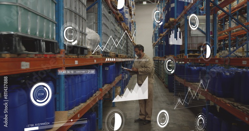 Image of financial data processing over biracial male worker in warehouse