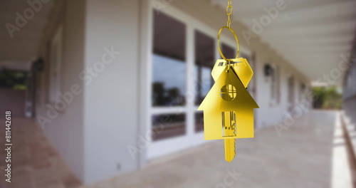 Image of golden key with house shape over house