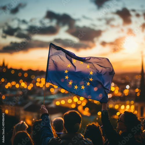 A photo of the European flag waving in front people