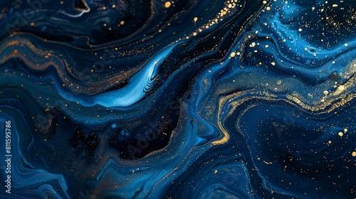 Blue and black acrylic paints with shimmering golden glitter. Liquid paint abstract background.