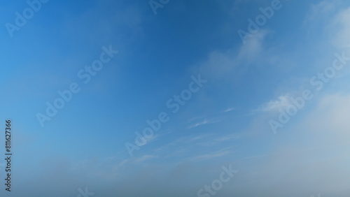 Fluffy layered clouds sky atmosphere. Majestic amazing blue sky with clouds. White and blue colors. Timelapse.