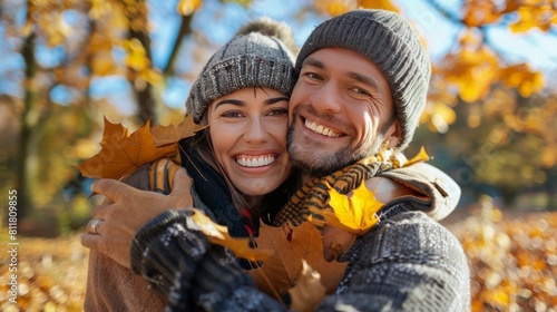 love, relationship, family and people concept - close up of smiling couple with bunch of leaves