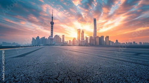 Shanghai city skyline and asphalt race track ground at sunrise,high angle view