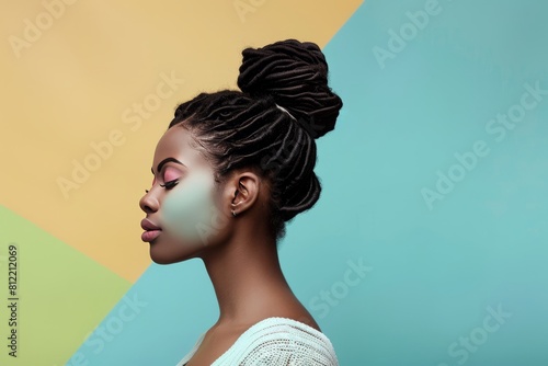 African American Women with African style bun hairdo and dress with pastel background