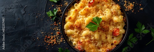 Lobster mac and cheese with breadcrumbs, top view horizontal food banner with copy space