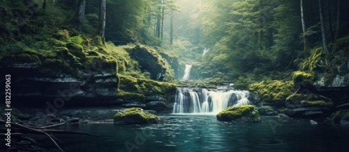 a waterfall with a river full of rocks in a lush forest