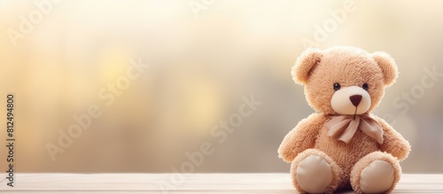 A close up image of an adorable teddy bear with copy space for text