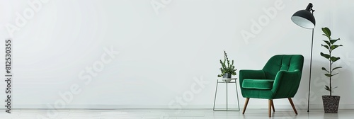 A mockup is a soft cozy green armchair with a plant and a lamp on the background of an empty wall, a mockup for the interior, a mockup for a painting.