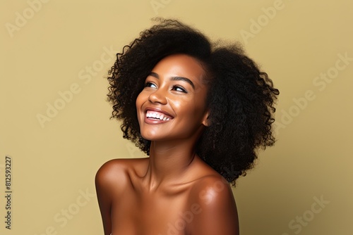 Beautiful black woman smiling and having in studio shot.