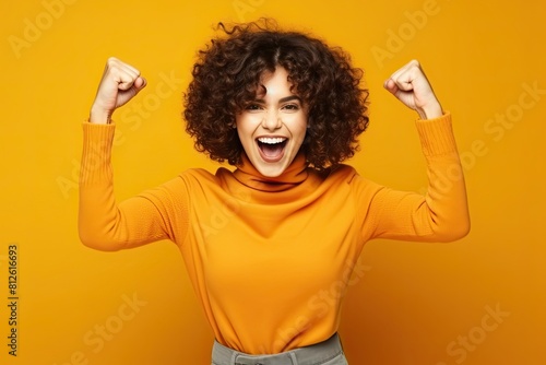 Ecstatic woman shout loud yeah fist up raise win lottery isolated bright shine color background