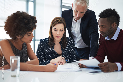 Lawyer, group and documents in office with people, reading and thinking for problem solving at legal agency. Team, men and women with paperwork, review and investigation for case lead at law firm