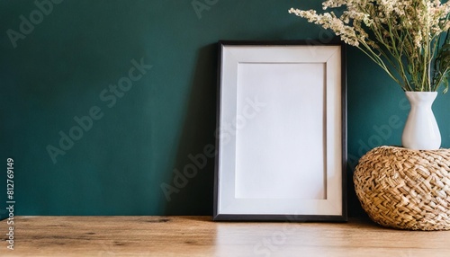 mockup poster frame in minimalist interior background with dark green wall