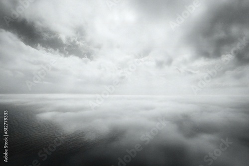 Foggy seascape with clouds in black and white