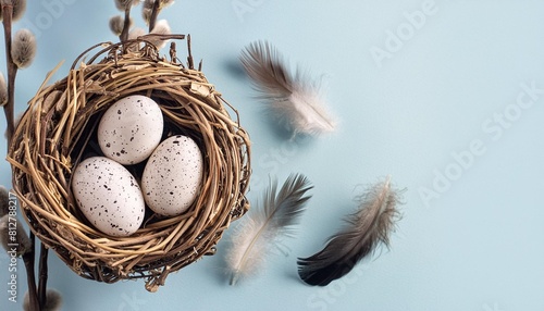 banner easter eggs with feathers in a nest on a blue background a nest with feathers floats in the air
