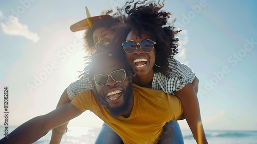 African american happy couple having fun piggyback riding and playing airplane on the beach Black man and afro hair woman in playful moment on the shore at summer time Concept of hap : Generative AI