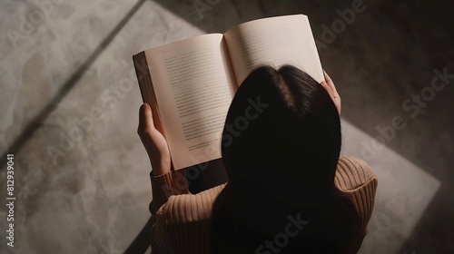top view of a woman reading an open book or magazine empty page mock up : Generative AI