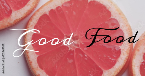 Image of good food text over sliced grapefruits on white background