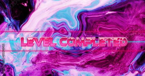 Image of level completed text in metallic pink over pink and blue liquid waves
