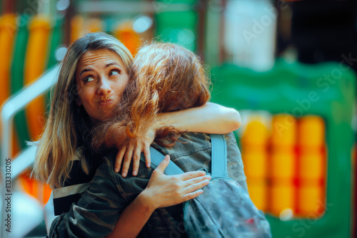 Woman Hugs Fake Friend Making Faces Behind her Back. Backstabbing toxic girlfriend embracing someone with bad intentions 