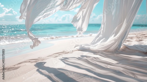 Elegant white fabric curtains flutter in the breeze at a beach shade setup along the seashore.