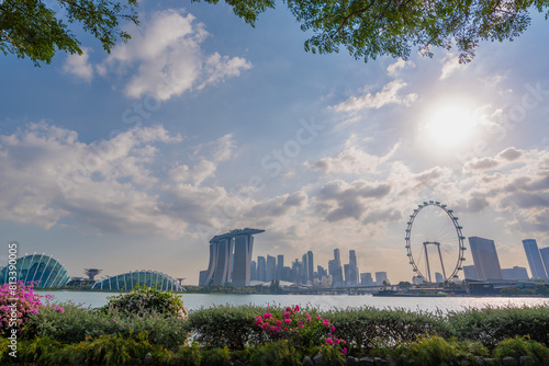 People exercising together in a city park at early evening, Singapore. The most beautiful Viewpoint marina bay, Asia business concept image, panoramic modern cityscape building in Singapore.